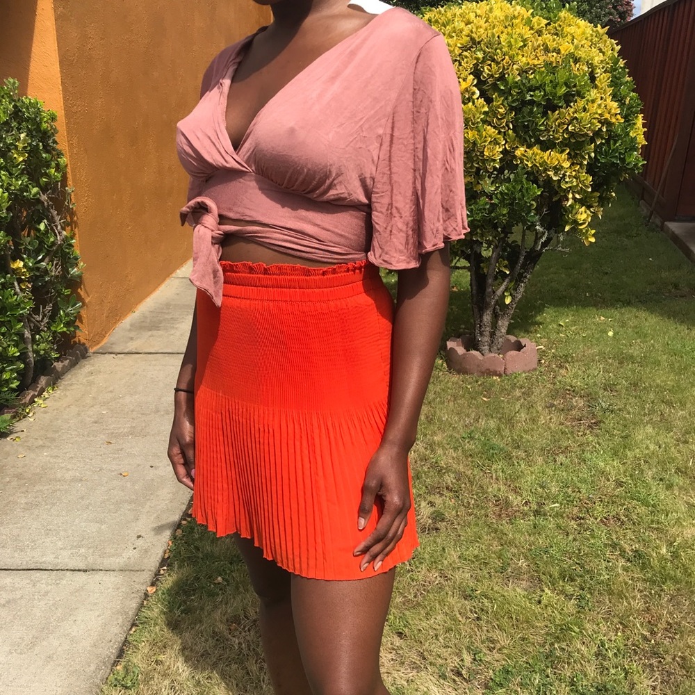 Bright orange ruffle / pleated skirt